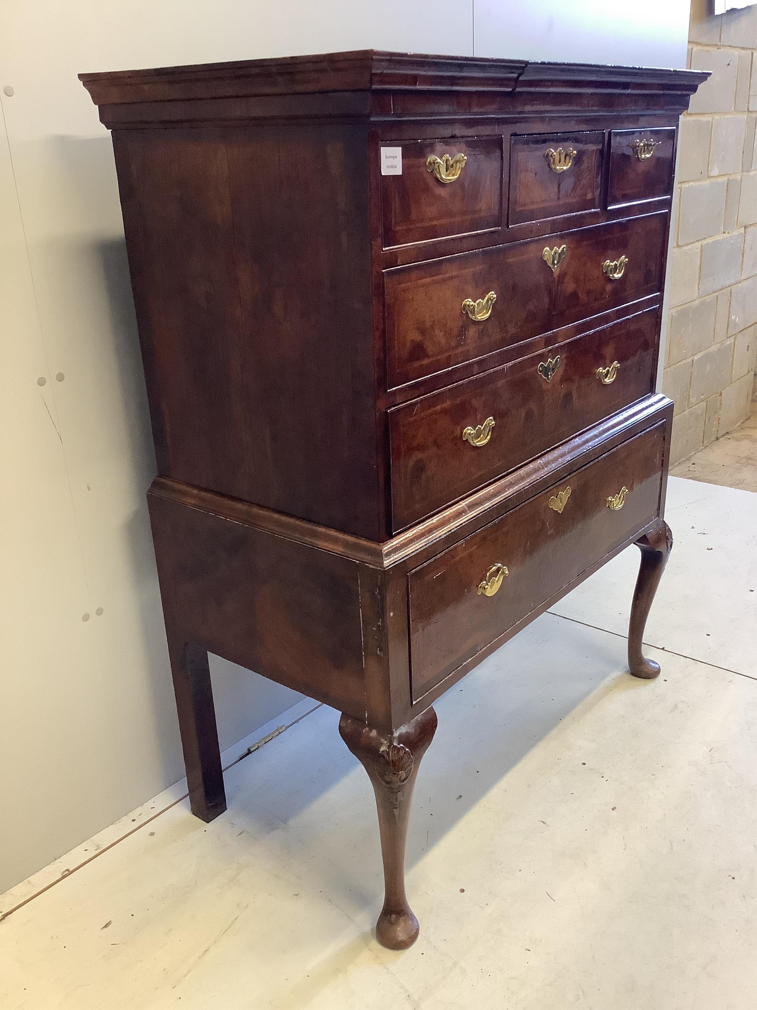 A George II walnut chest on stand, width 104cm, depth 56cm, height 133cm. Condition - fair